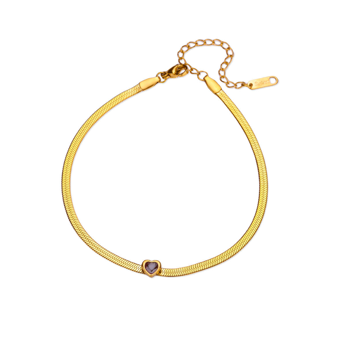 Gold heart charm anklet worn on ankle